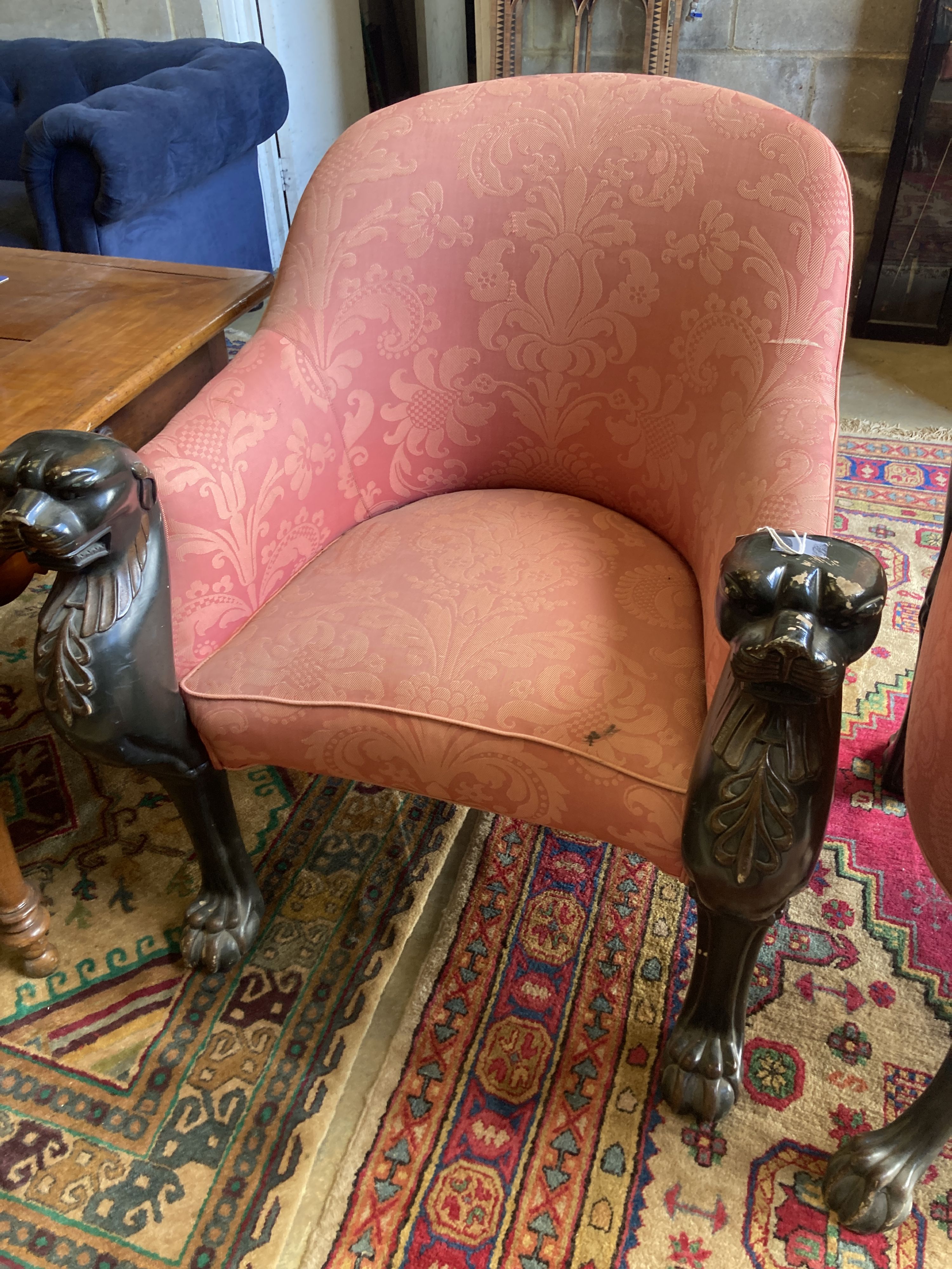 A pair of Empire style upholstered armchairs in the manner of Thomas Hope with leopards head terminals, width 80cm, depth 80cm, height